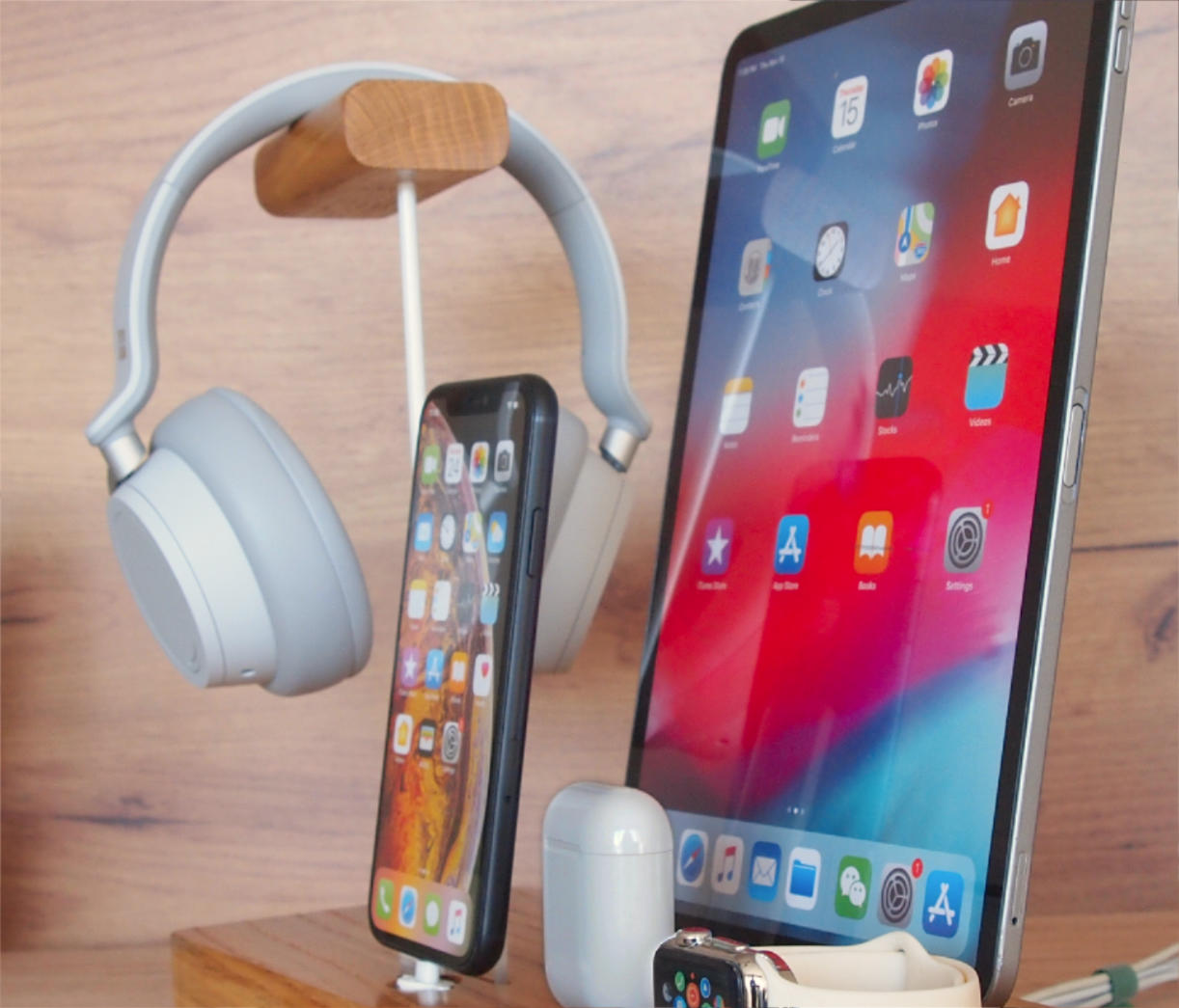 Docking station from oak wood for iPhone, iPad, earbuds, apple watch and headphones